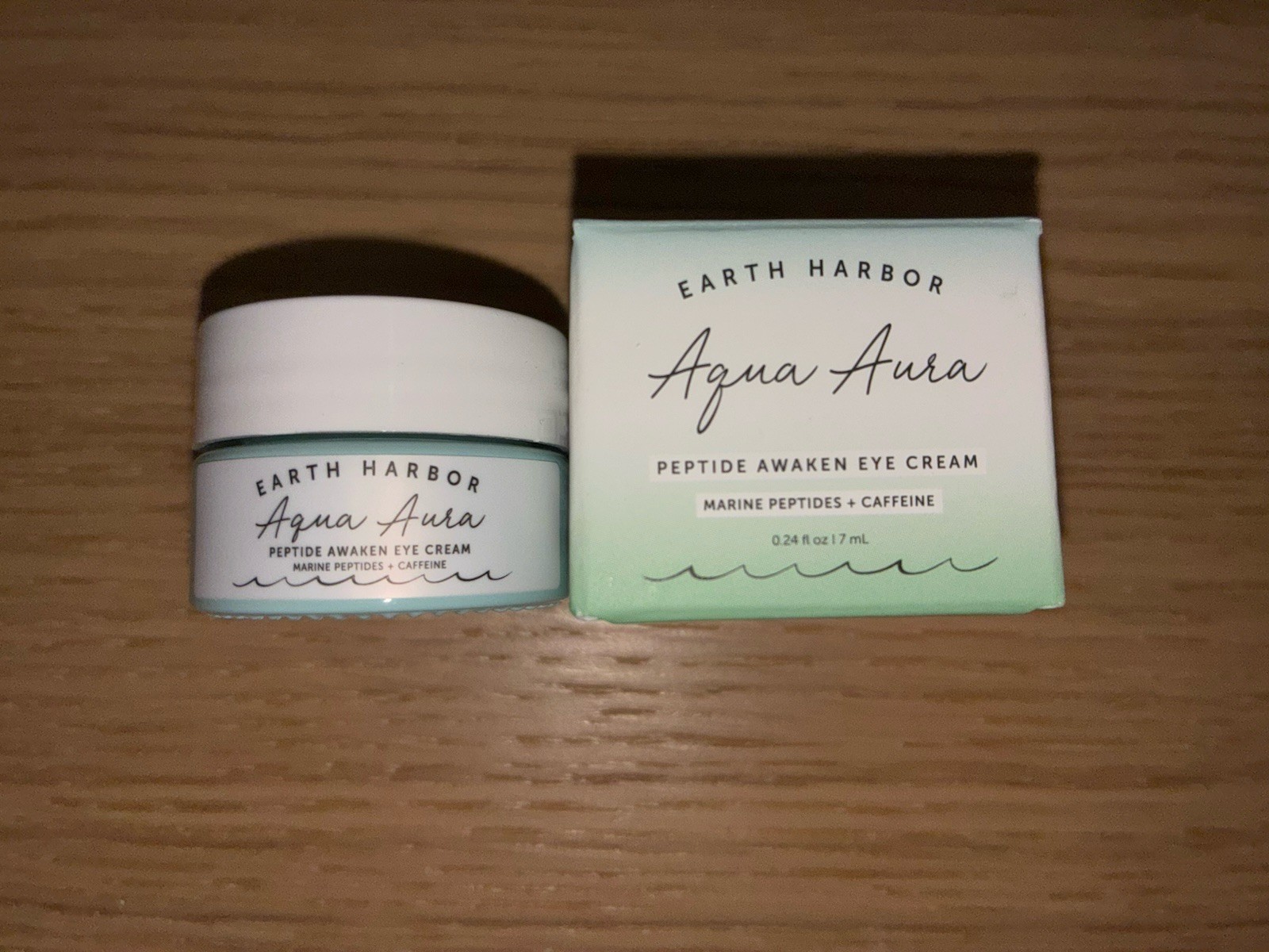 Earth Harbor Aqua Aura Peptide Awaken Eye Cream in a 0.24 fl oz size.