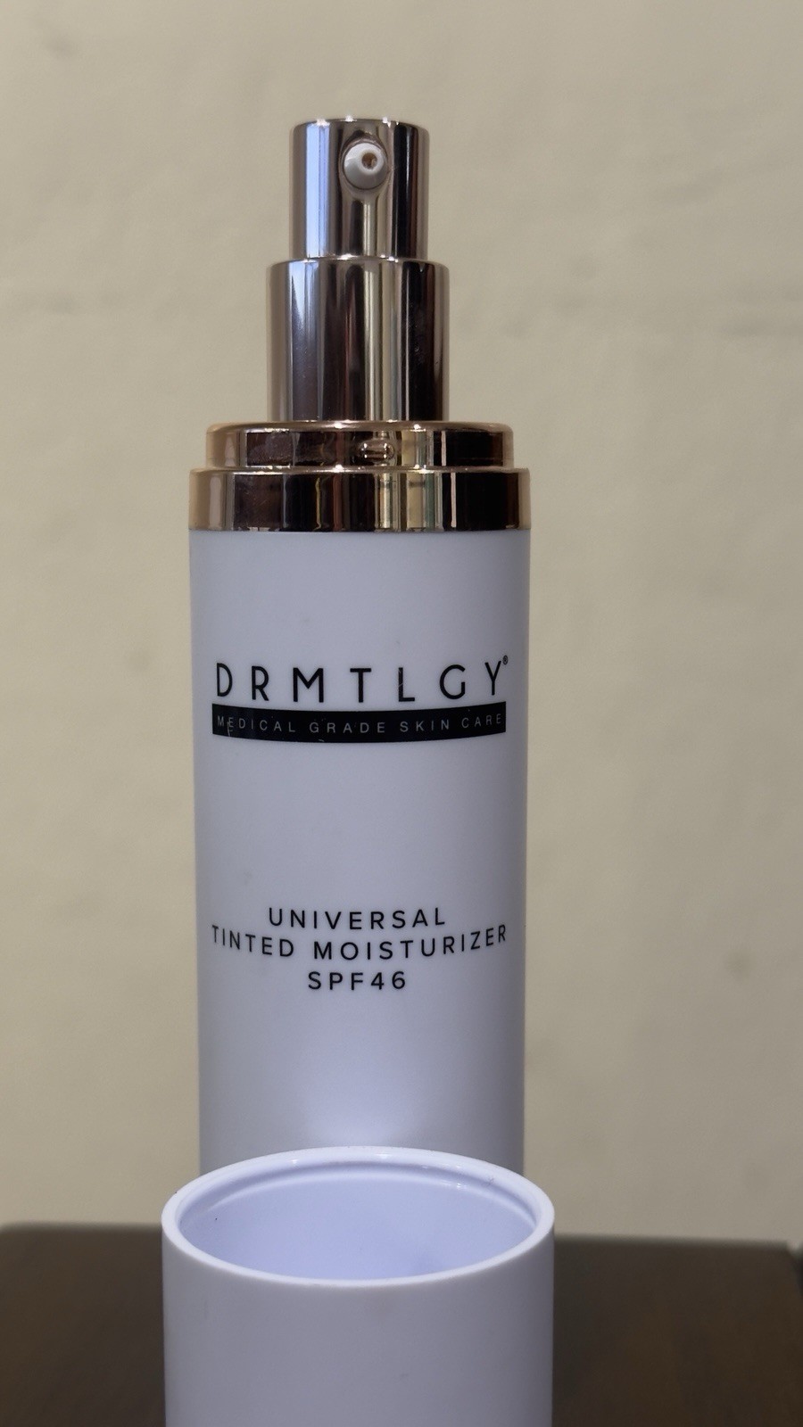 1.7 oz bottle of DRMTLGY Universal Tinted Moisturizer with SPF 46.