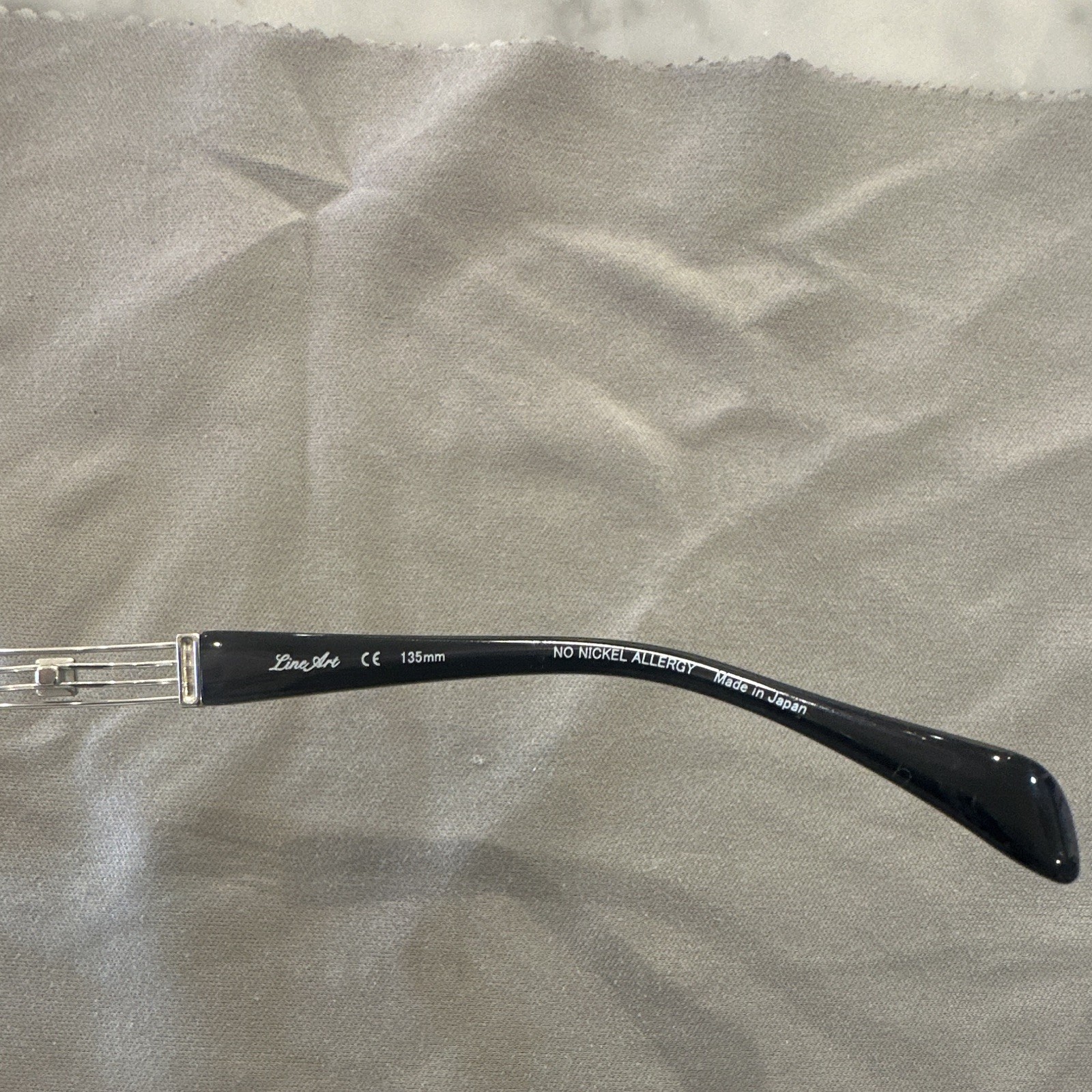 Charmant Line Art XL Rimless Black And Silver Frame. Retail $425