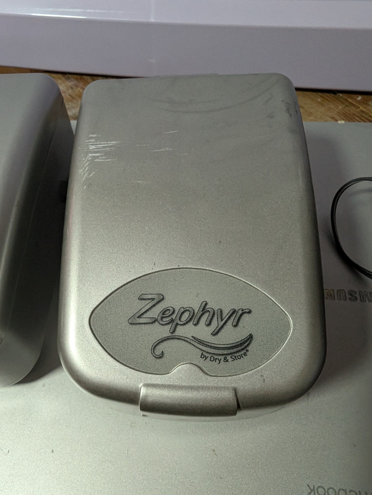 Two Zephyr by Dry & Store, an electronic dehumidifier